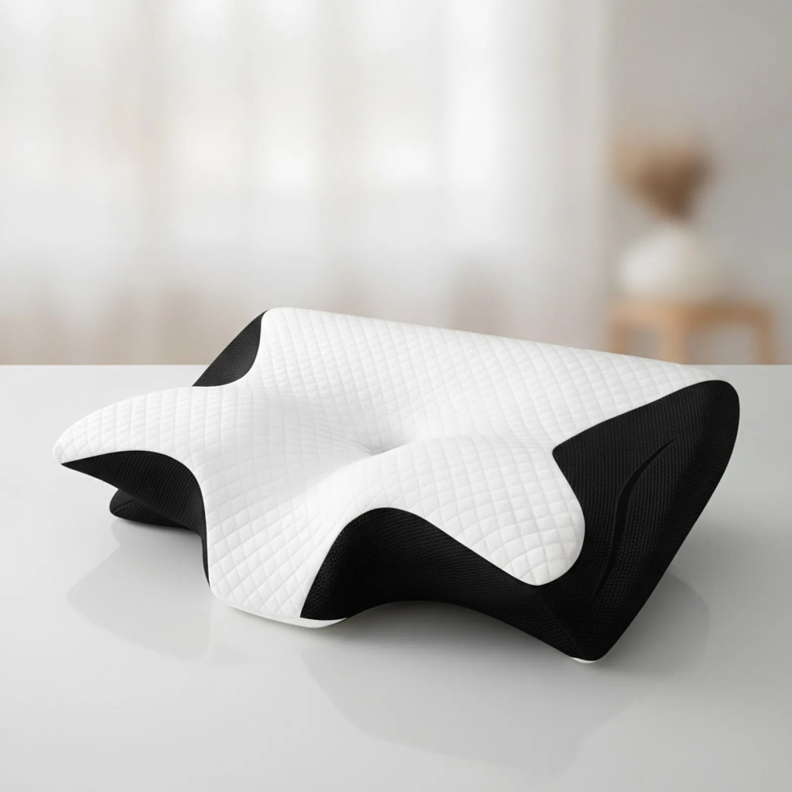 Oreiller ergonomique CerviRest Pro ChronoStyle en mousse à mémoire de forme blanc et noir avec design profilé.