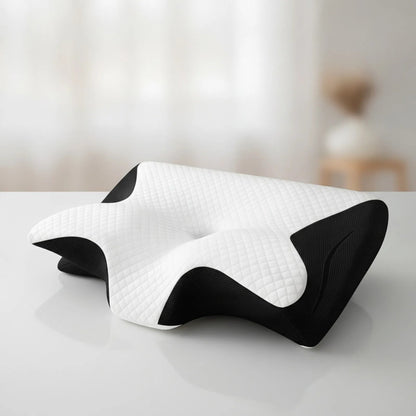 Oreiller ergonomique CerviRest Pro ChronoStyle en mousse à mémoire de forme blanc et noir avec design profilé.